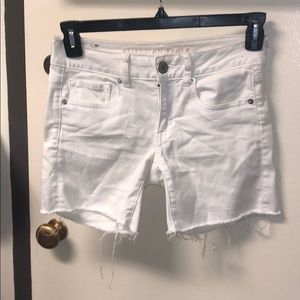 White AE Outfitters frayed hem midi shorts
